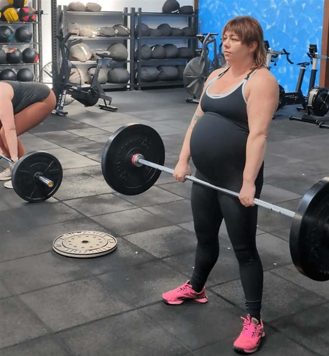 Pregnant woman deadlifting