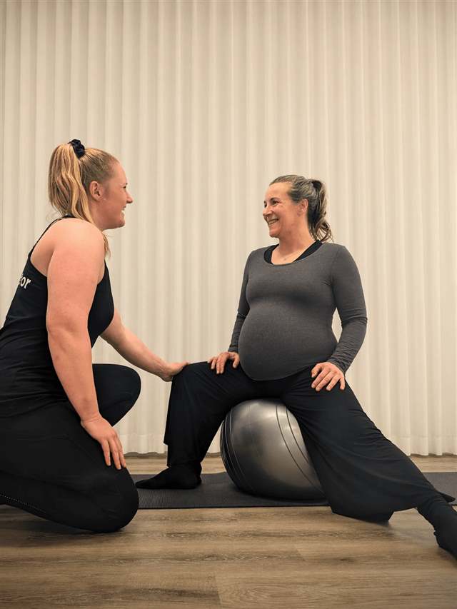 Katie coaching on a fit ball