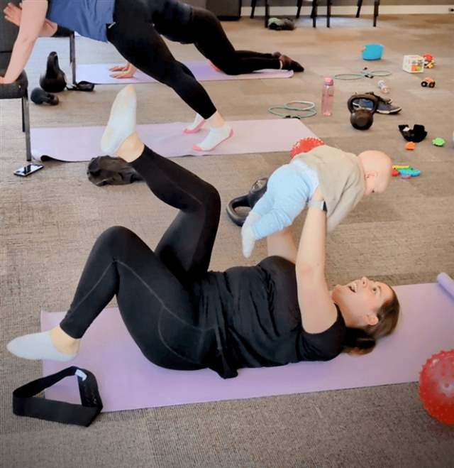 Mum doing core work with baby